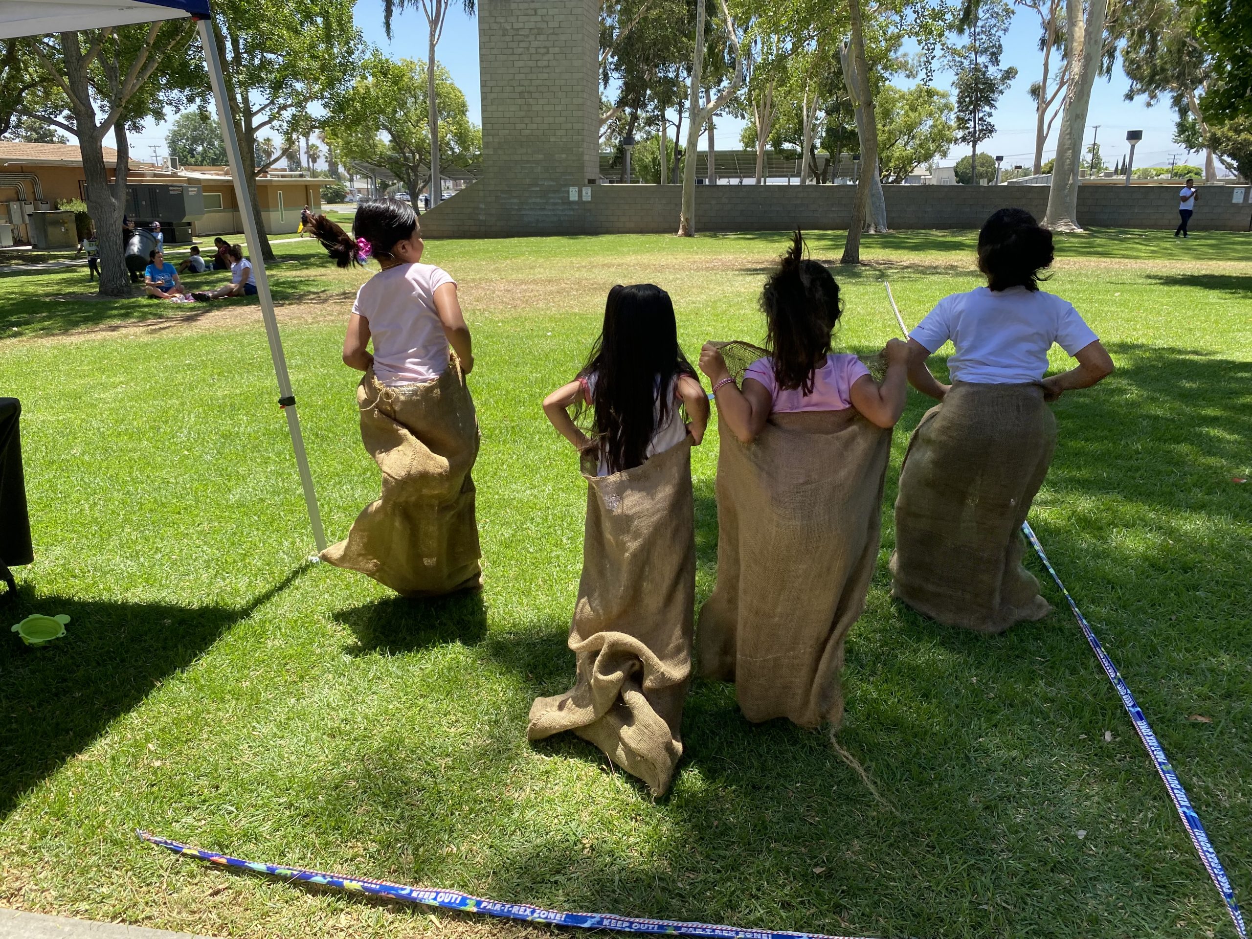 Children racing in sack cloth bags